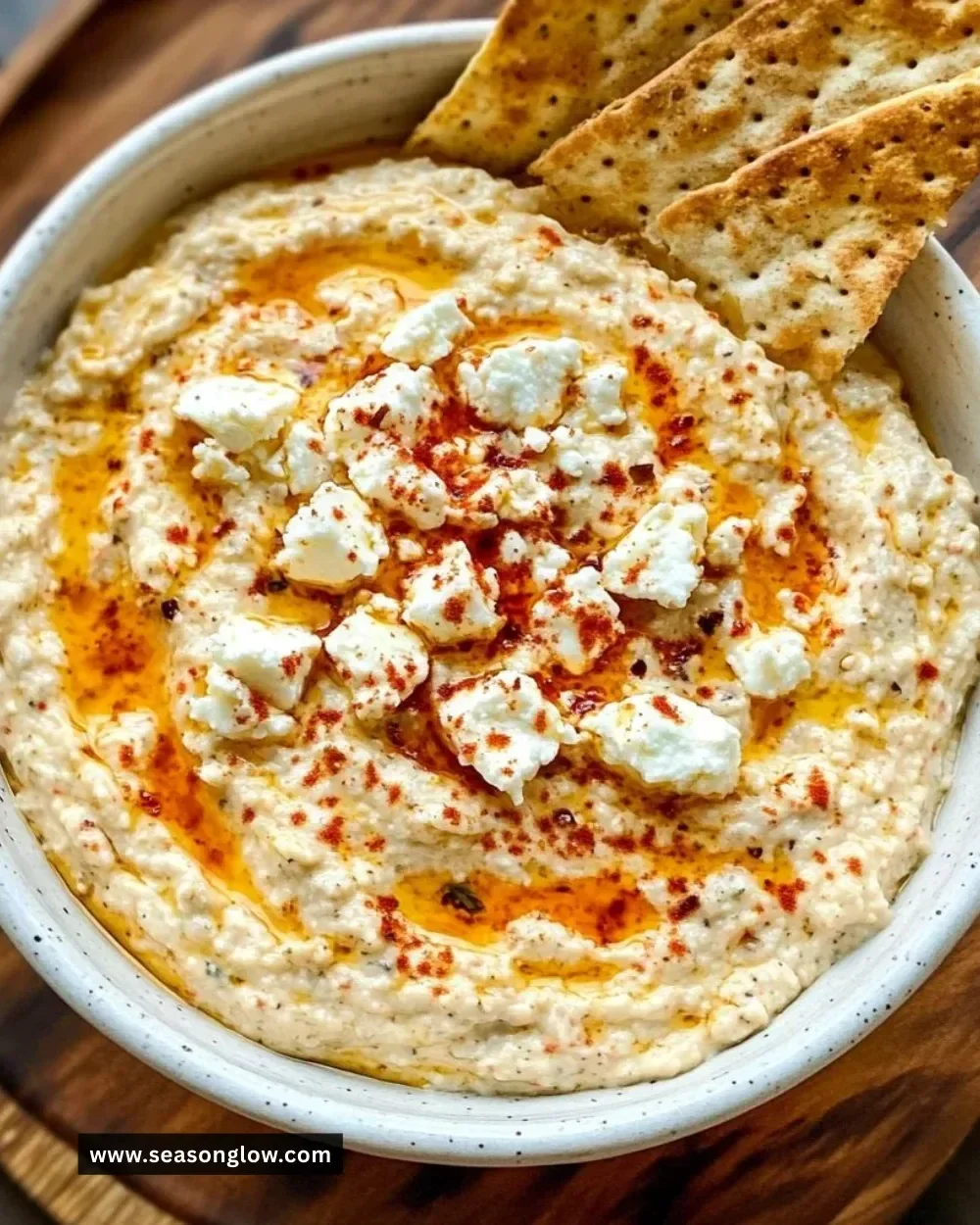 Tirokafteri Greek spicy feta dip served in a bowl with pita bread