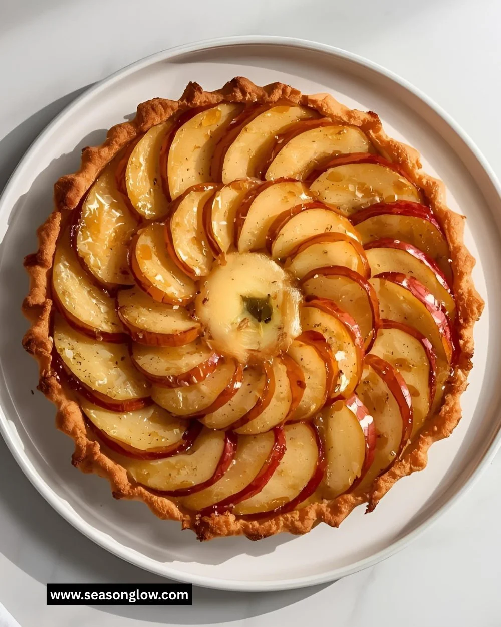 Delicious Vegan Apple Tart topped with fresh apples and a golden crust