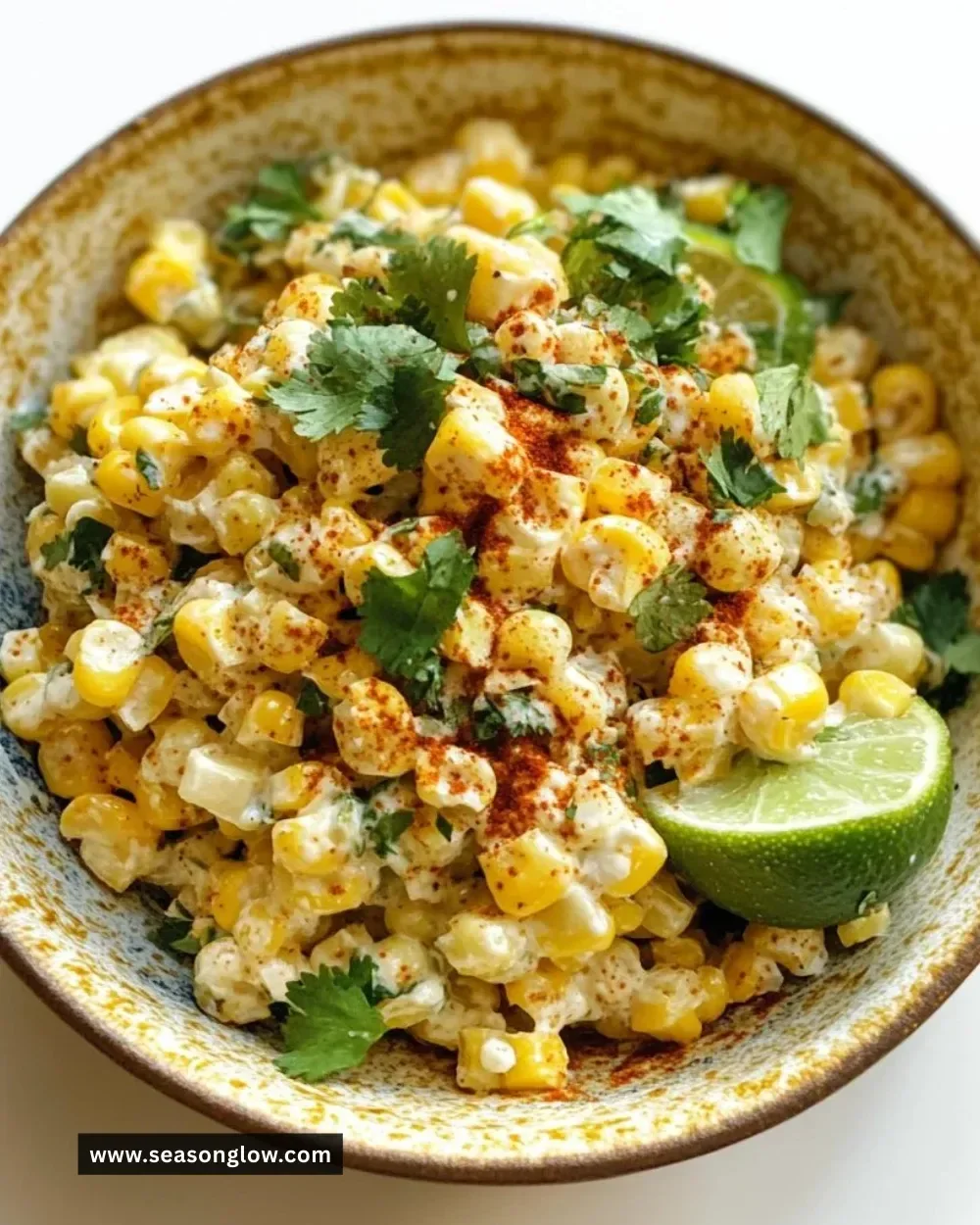 Vegan Mexican Street Corn Salad with corn, avocado, and spices in a bowl