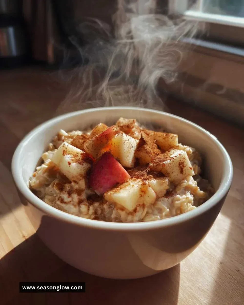 Bowl of 5-Minute Apple Pie Oatmeal topped with apples and cinnamon