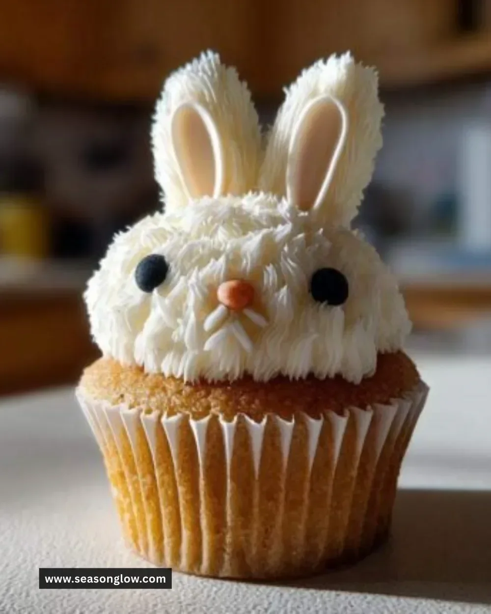 Amazing carrot cake bunny cupcakes decorated with frosting and chocolate ears