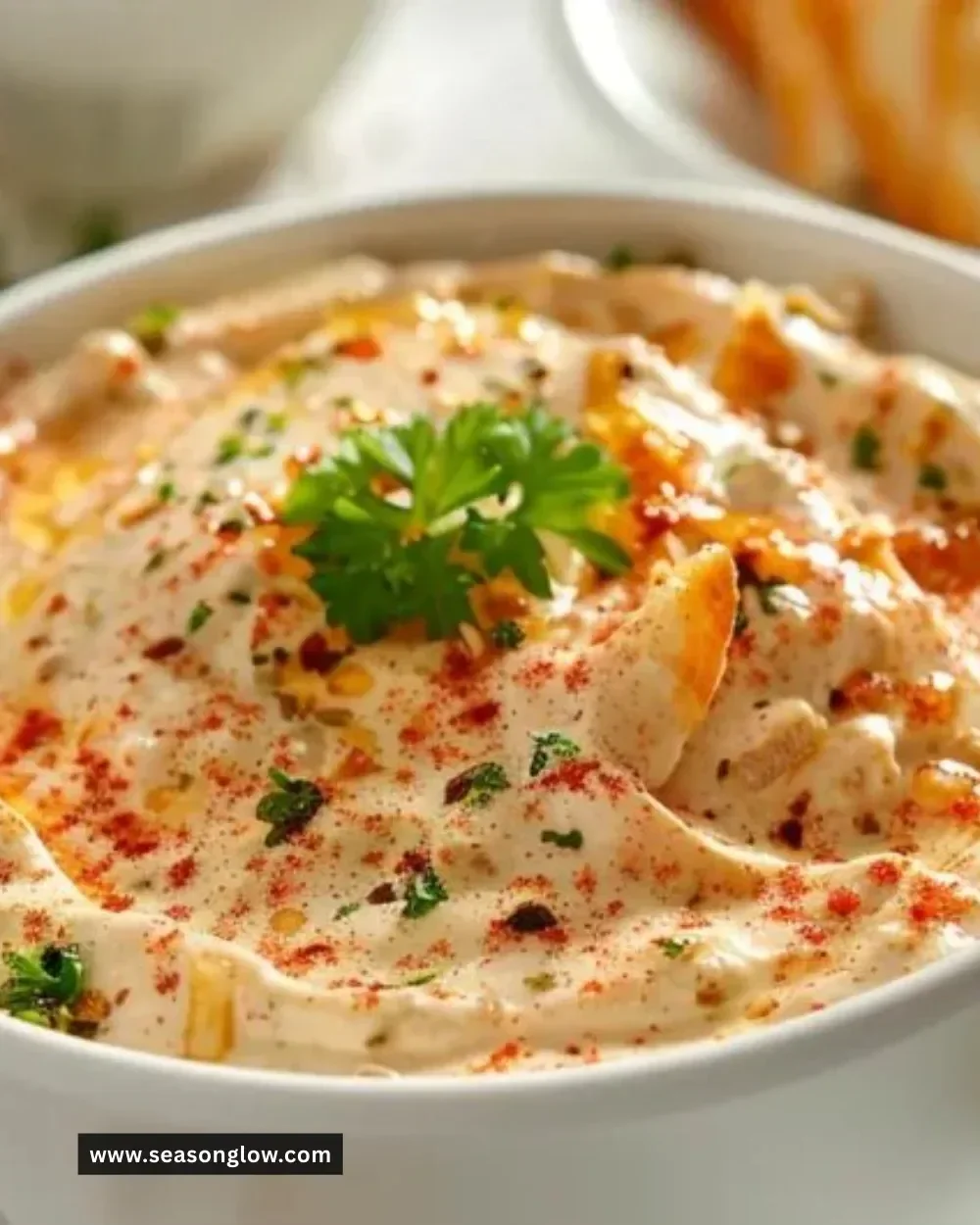 Delicious TikTok Boat Dip served in a bowl with fresh ingredients