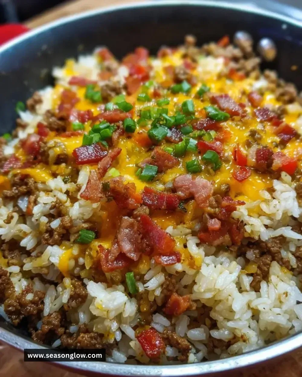 Delicious Bacon Cheeseburger Rice Skillet topped with cheese and crispy bacon