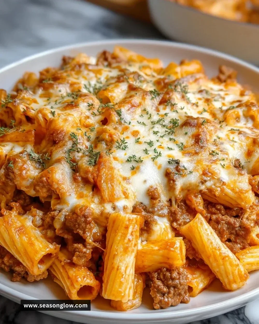 Creamy Beef Rigatoni Cheese Bake served in a casserole dish
