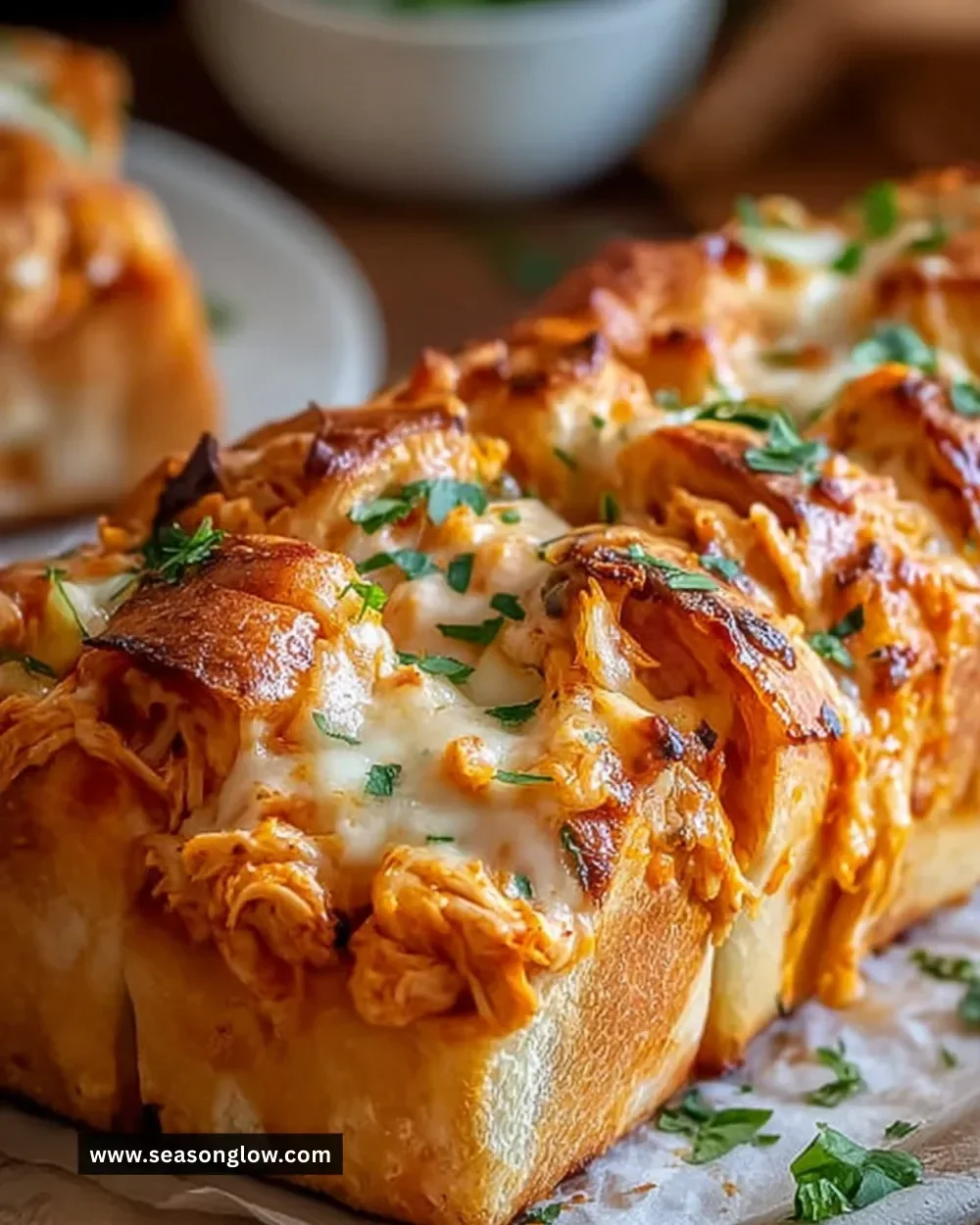 Delicious Buffalo Chicken Bread topped with cheese and herbs
