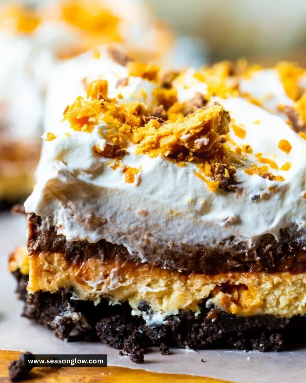 Delicious Butterfinger Lush dessert with chocolate and peanut butter layers