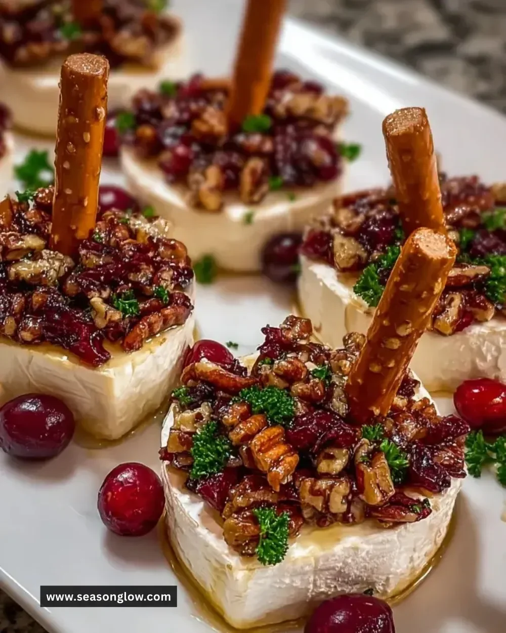 Delicious Candied Pecan Cranberry Brie Bites on a serving platter