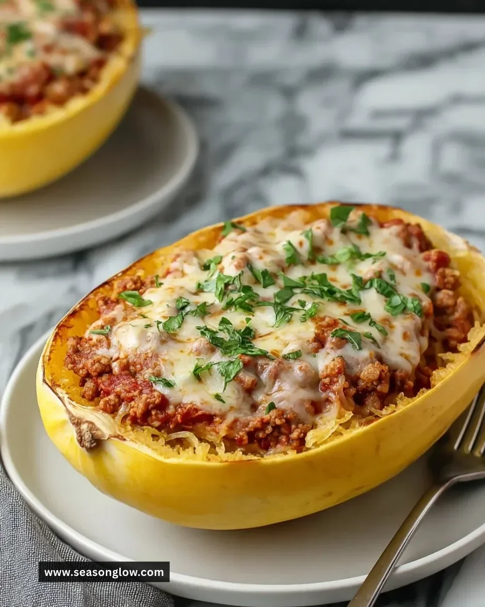 Cheesy garlic and herb spaghetti squash served with meat sauce