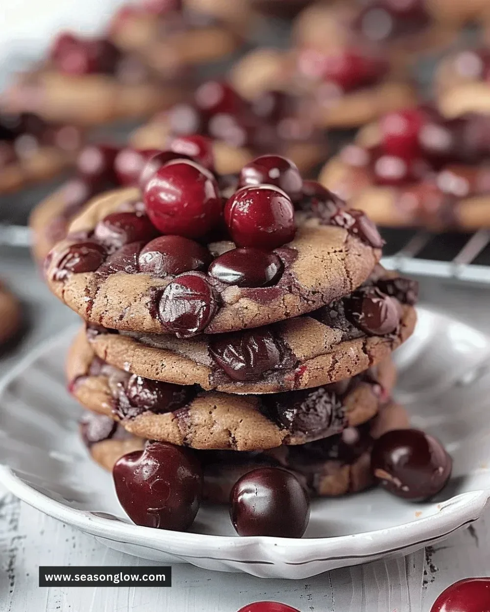 Delicious cherry chocolate chewy cookies on a baking tray.