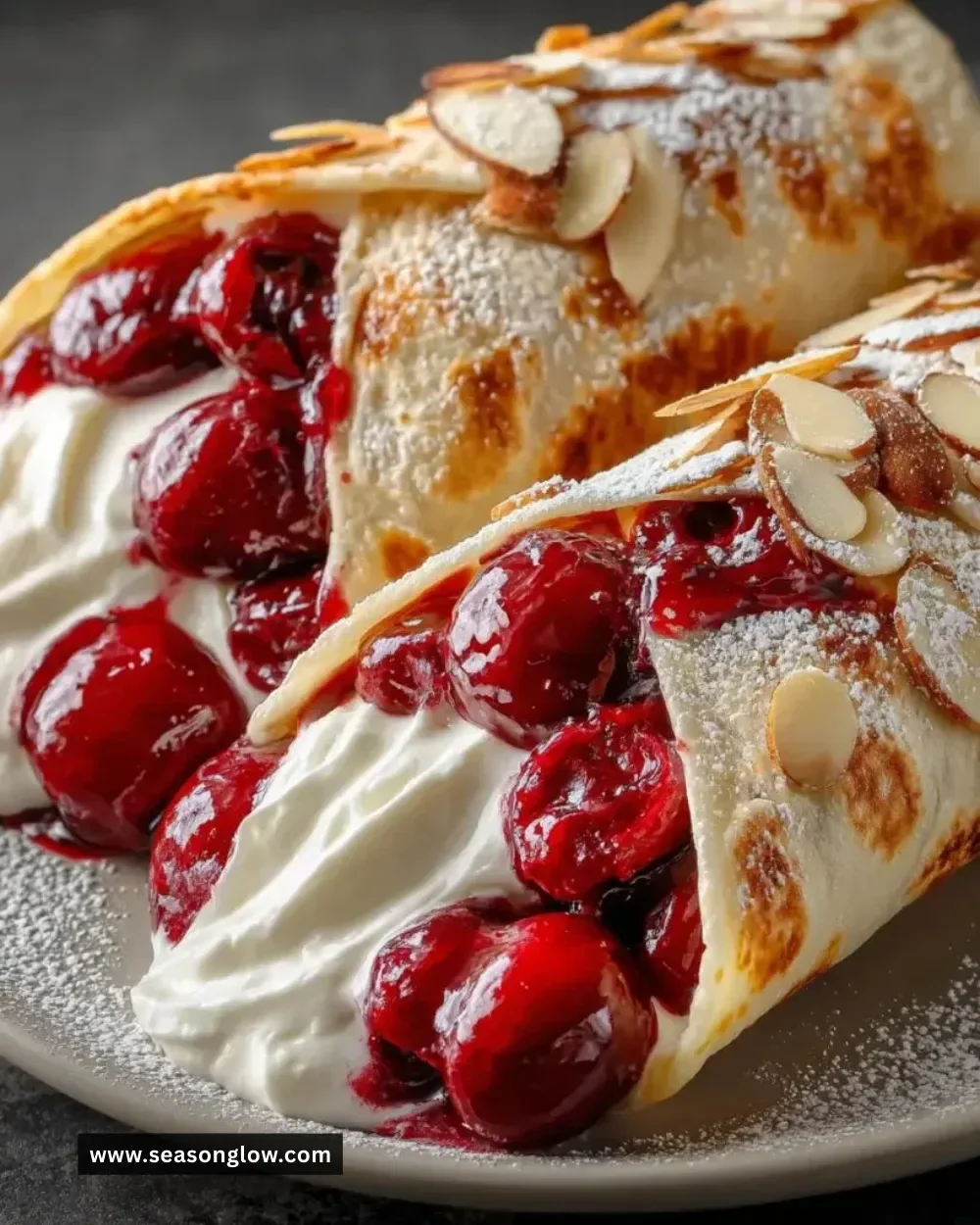 Delicious cherry pie filling breakfast wraps served on a plate.