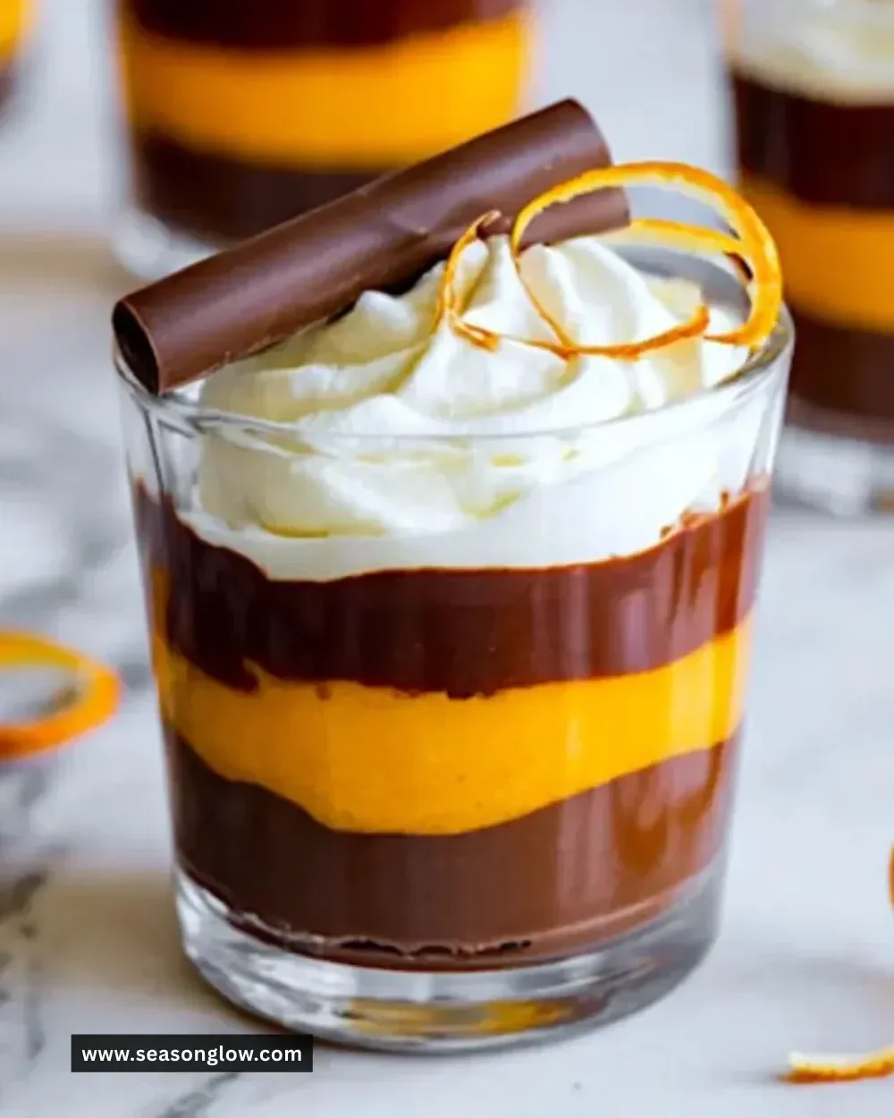 Chocolate orange trifle cups with layers of chocolate and orange flavors.