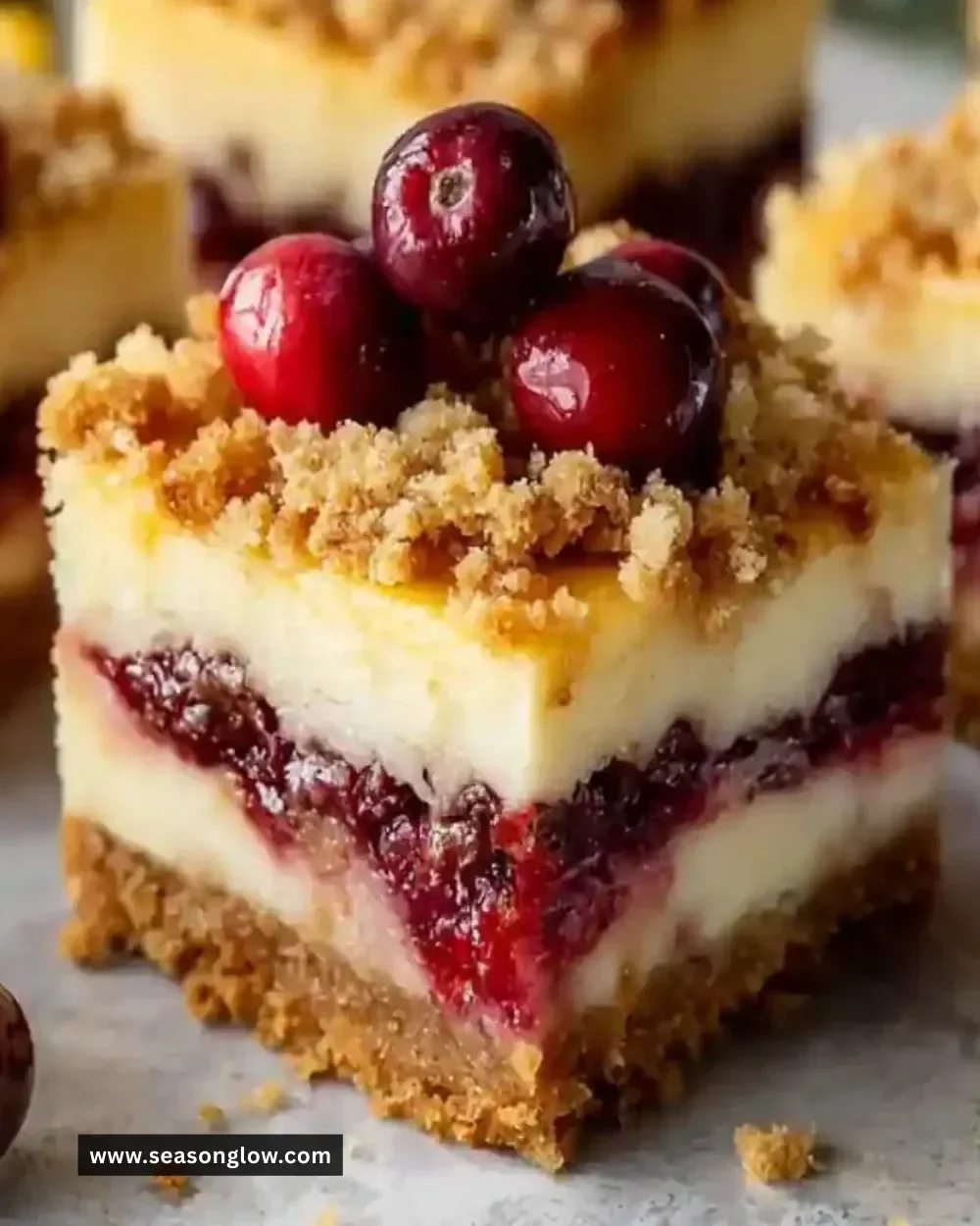 Christmas Cherry Cheesecake Bars with cherries on top