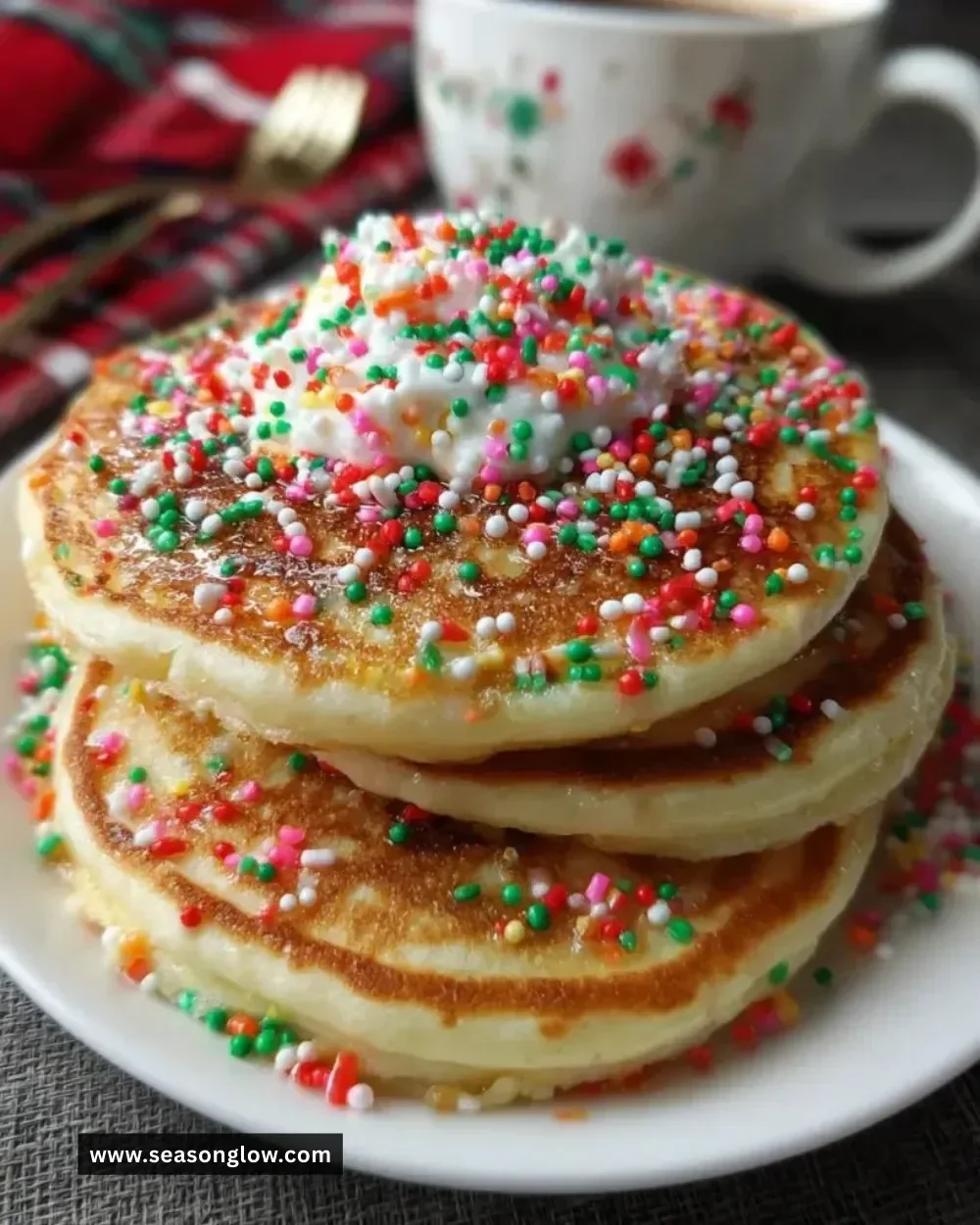 Fluffy Christmas pancakes topped with berries and syrup festive breakfast