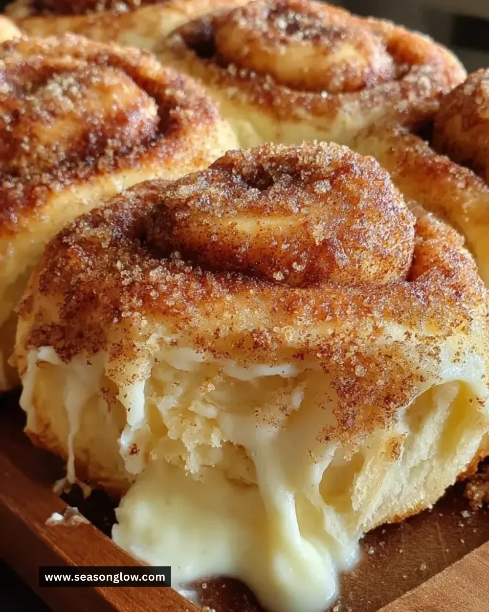 Cream cheese cinnamon sugar rolls topped with icing and sprinkled with cinnamon sugar