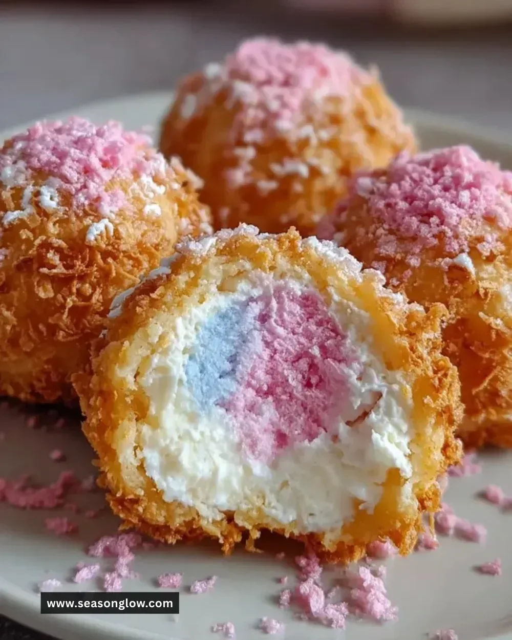 Crispy cotton candy cheesecake bombs topped with fluffy cotton candy