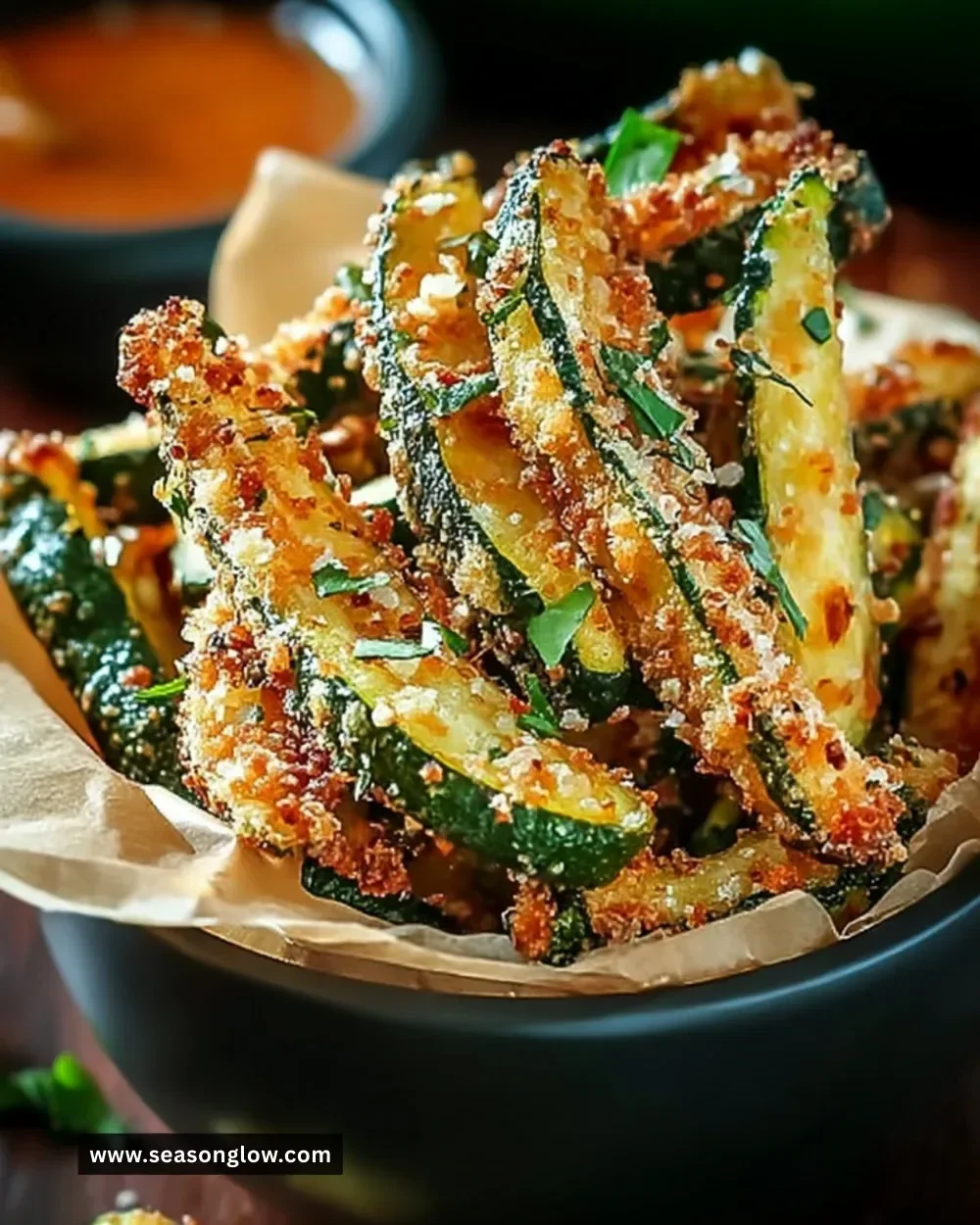 Plate of crispy zucchini fries, golden and delicious snack option.