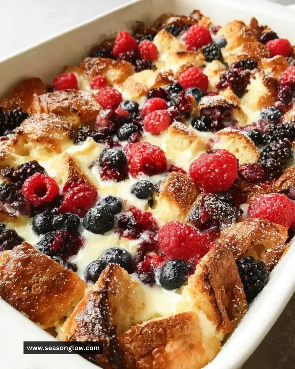 Delicious croissant breakfast casserole served with fresh fruit