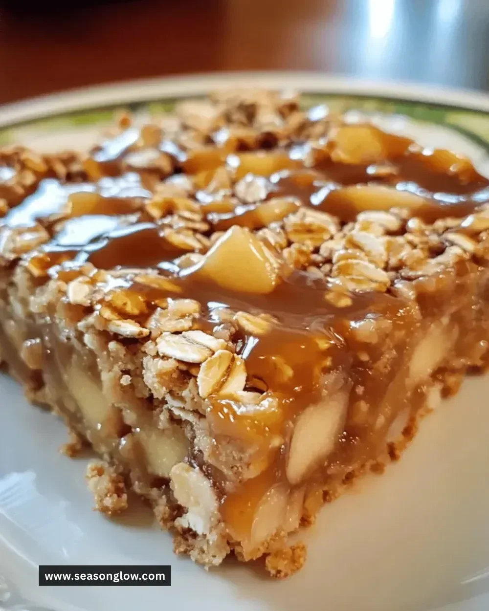 Delicious homemade caramel apple oat bars topped with caramel sauce.