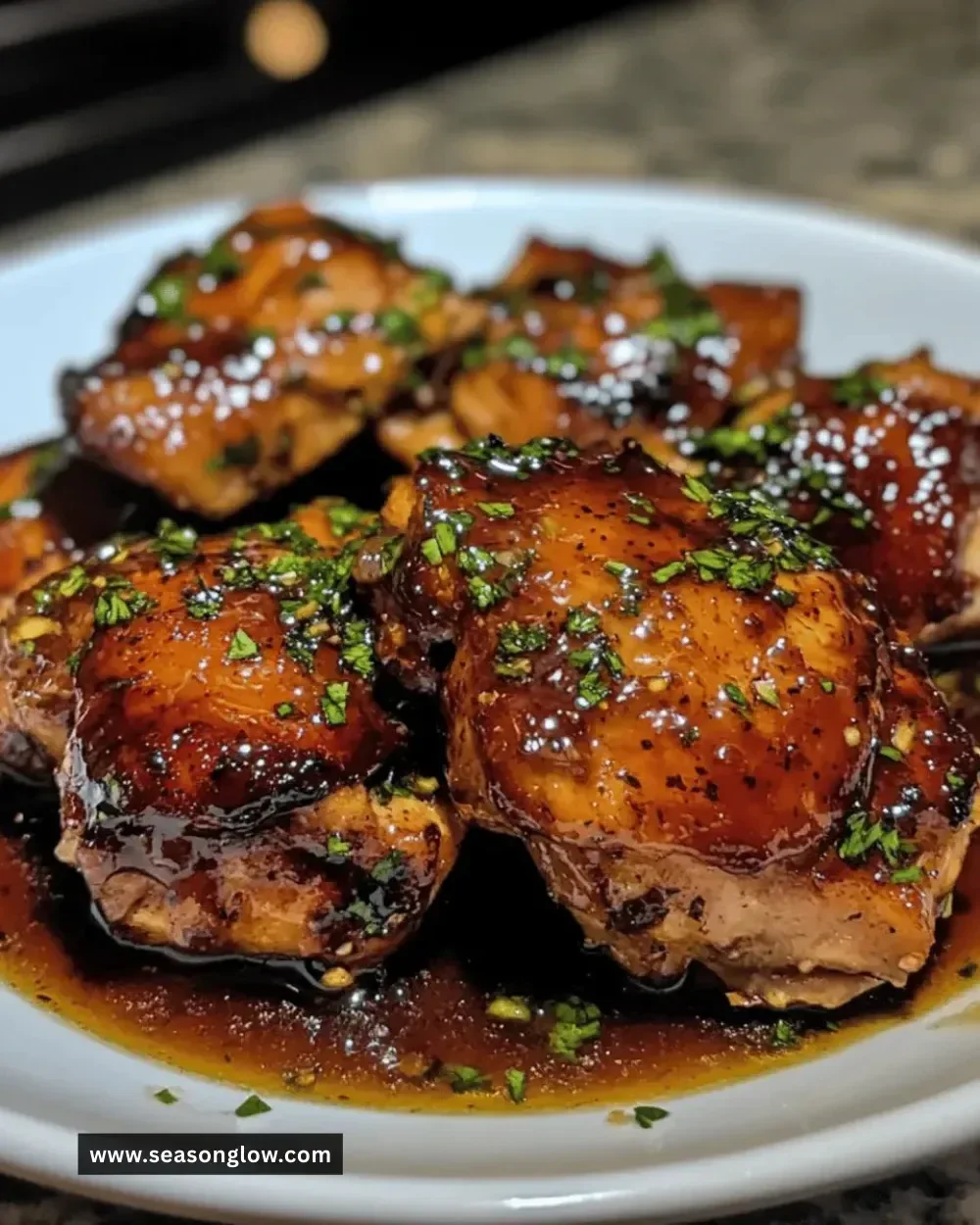 Delicious crockpot honey garlic chicken thighs served on a plate