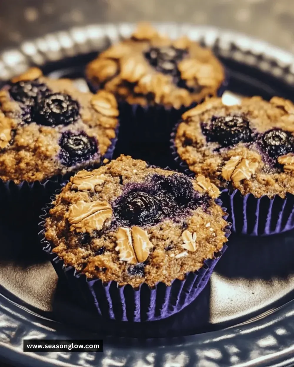 Freshly baked gluten-free blueberry oat muffins on a wooden table