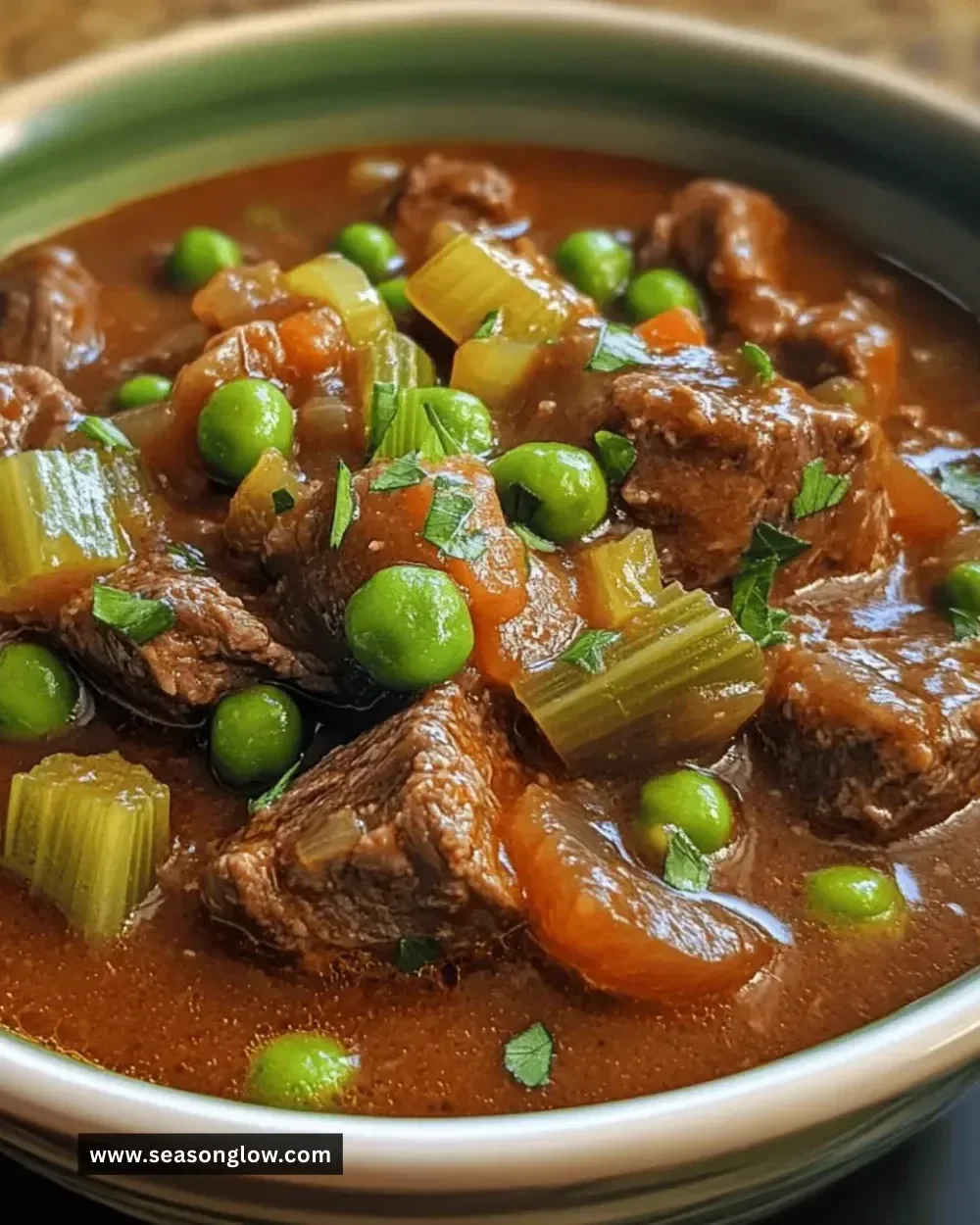 Delicious Easy Instant Pot Beef Stew with peas and celery served in a bowl.