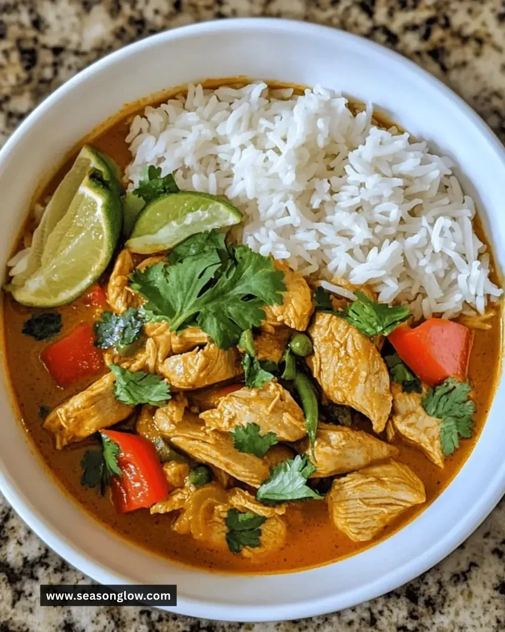 Bowl of easy Instant-Pot Thai chicken curry with fresh herbs and rice