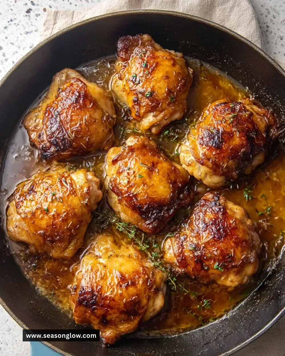 Garlic-Brown Sugar Chicken Thighs garnished and served on a plate