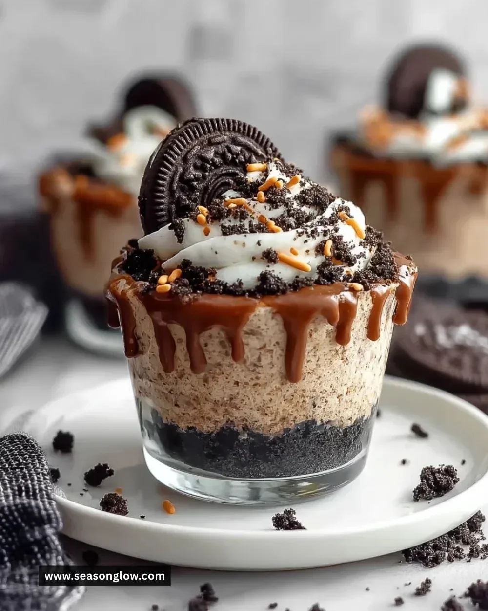 Graveyard Dirt Cake Cups with chocolate and gummy worms for Halloween