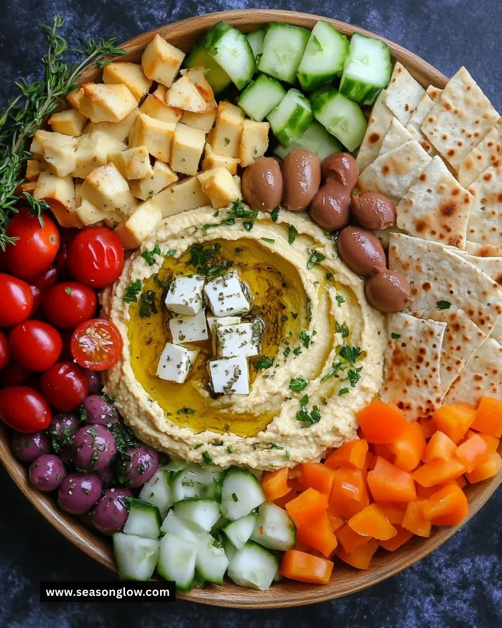 Greek hummus platter with assorted vegetables and dips