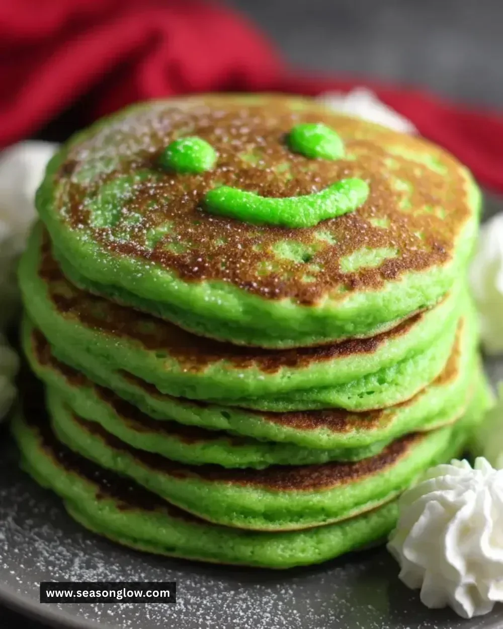 Delicious Grinch Pancakes topped with festive decorations