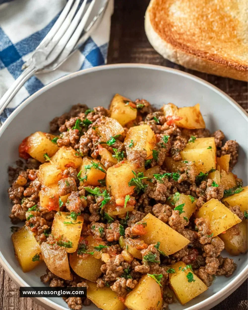 Ground Beef and Potato Skillet served in a cast-iron pan with garnishes