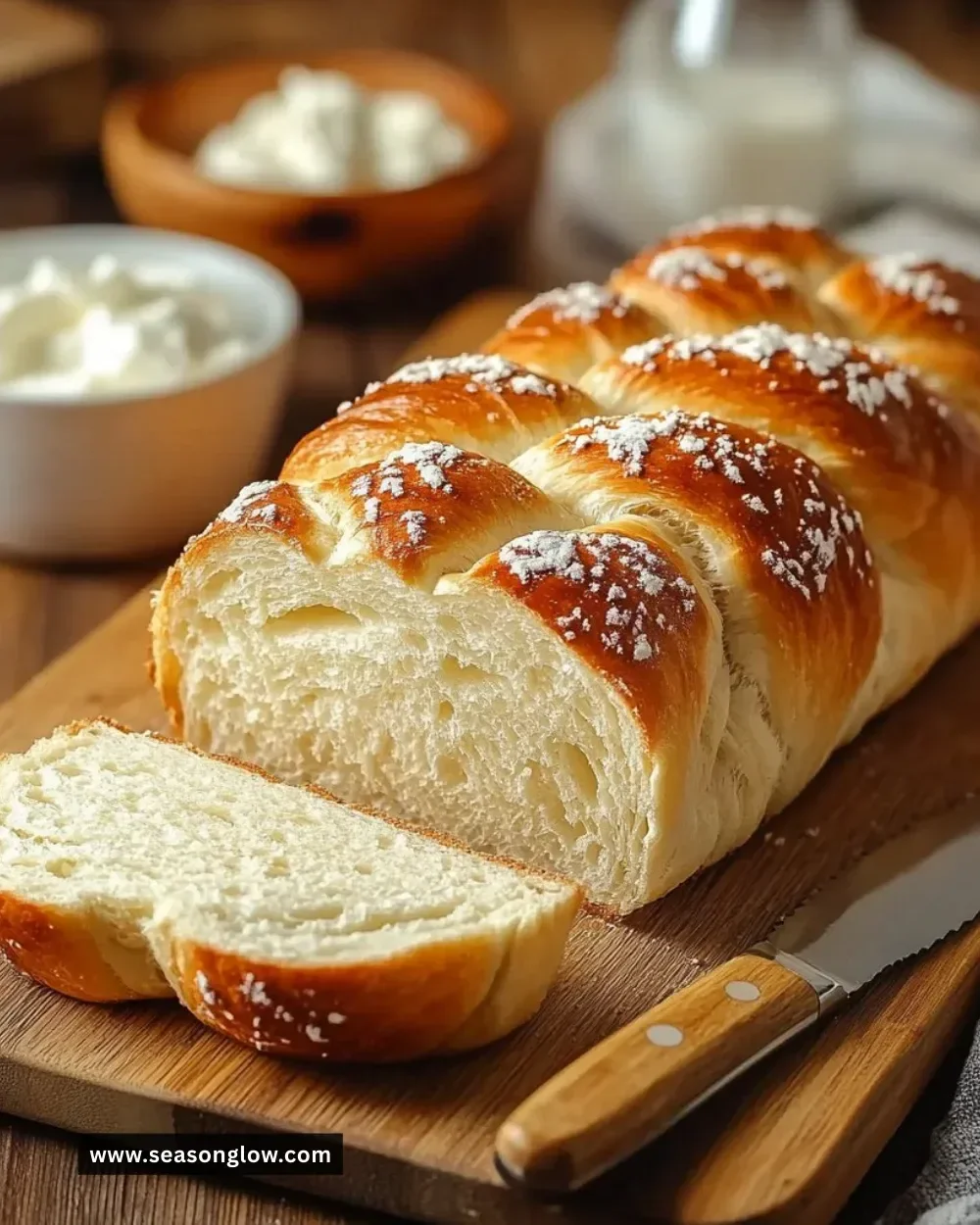Sliced healthy cottage cheese oat bread on a wooden cutting board