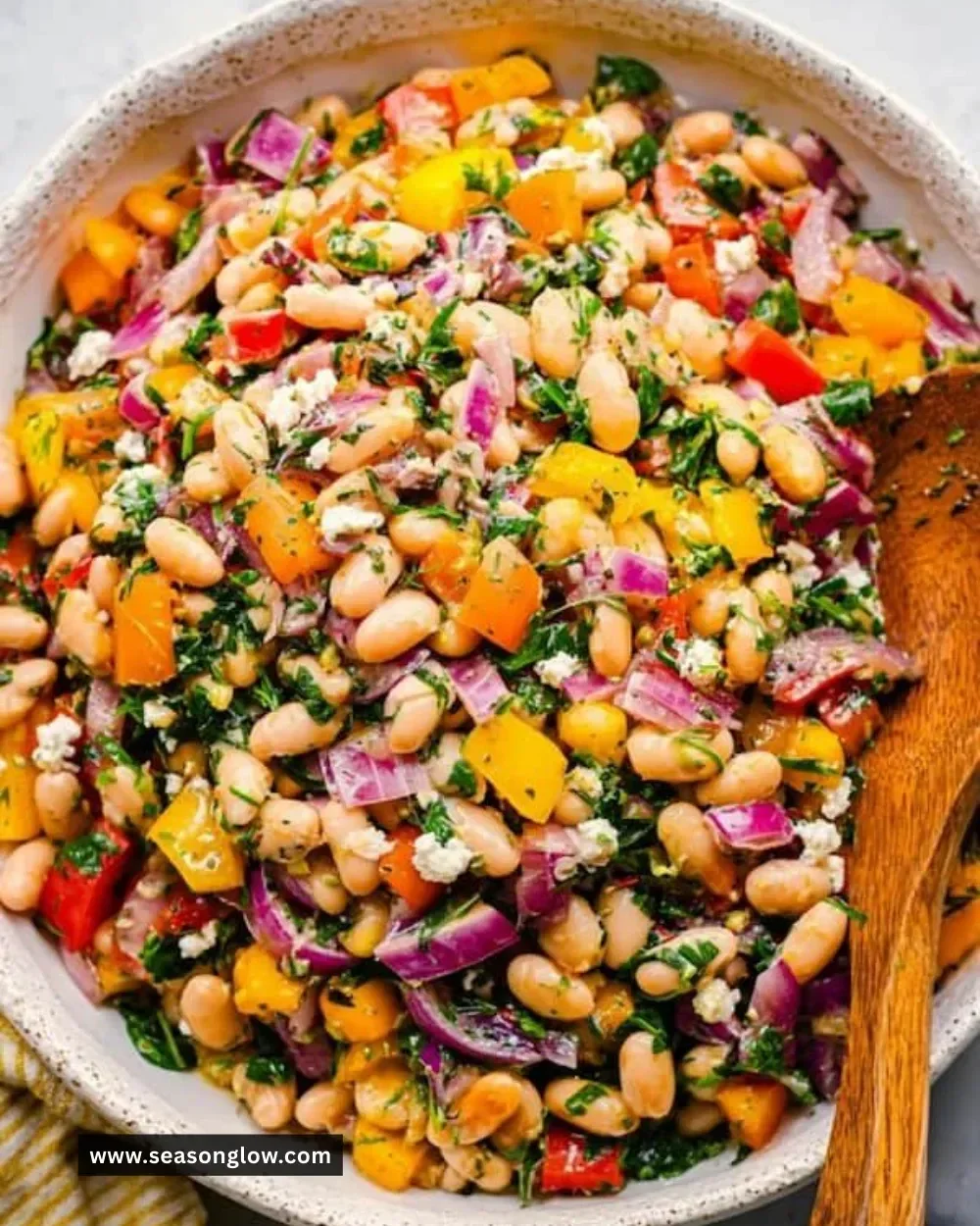 High protein dense bean salad with colorful vegetables in a bowl