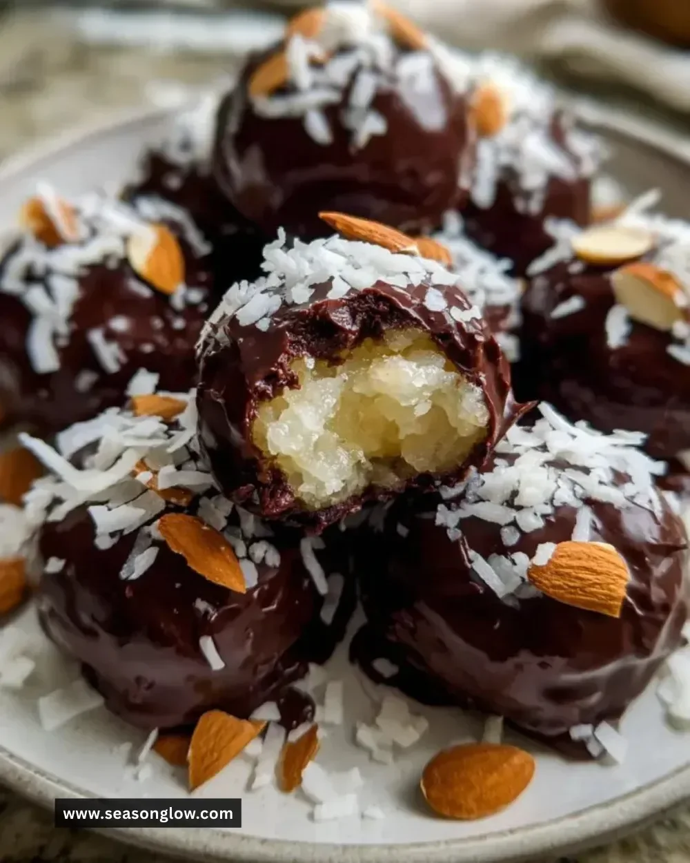 Delicious homemade Almond Joys with chocolate and coconut filling.