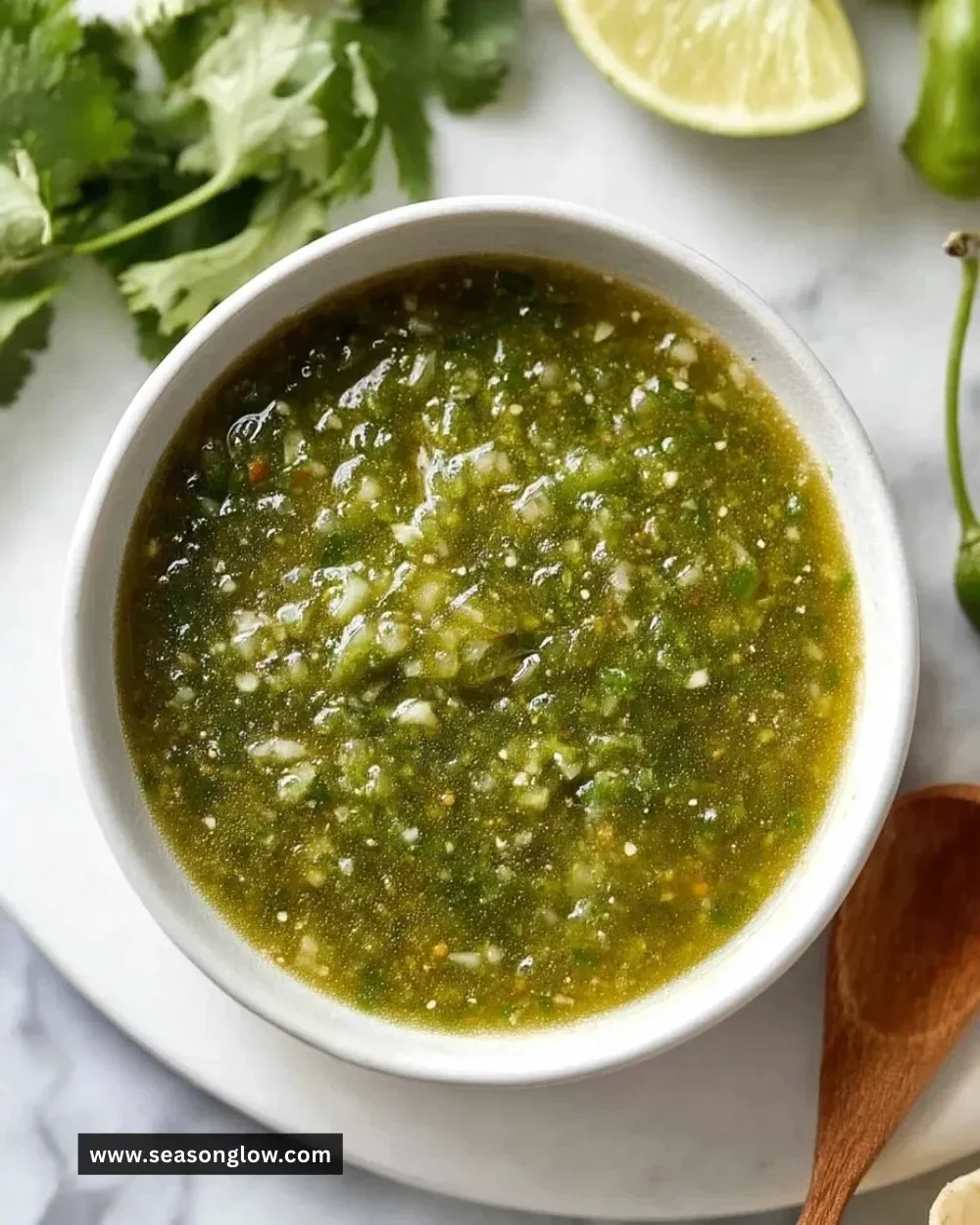 Bowl of homemade green salsa with fresh ingredients.