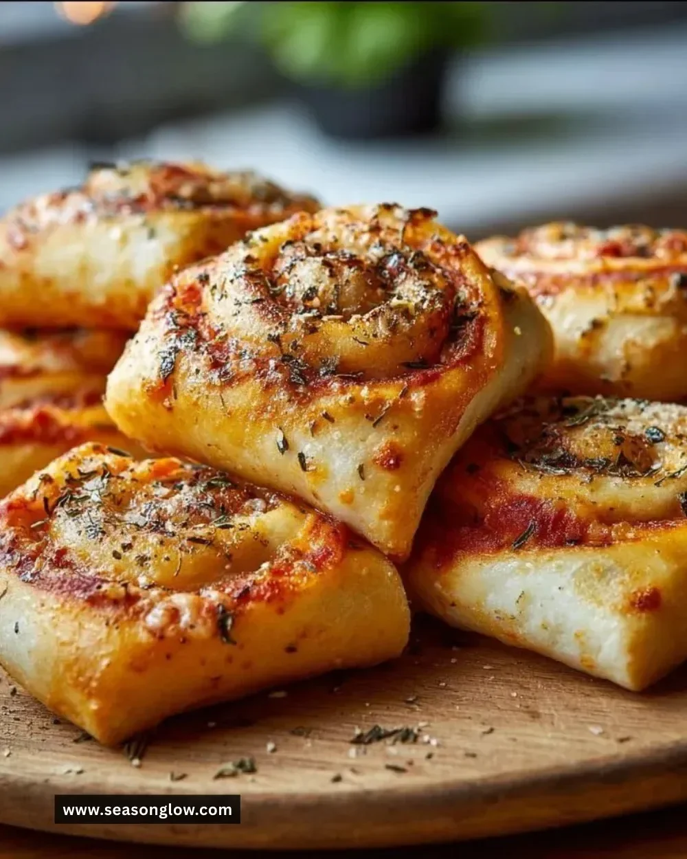 Freshly baked homemade pizza rolls filled with cheese and pepperoni
