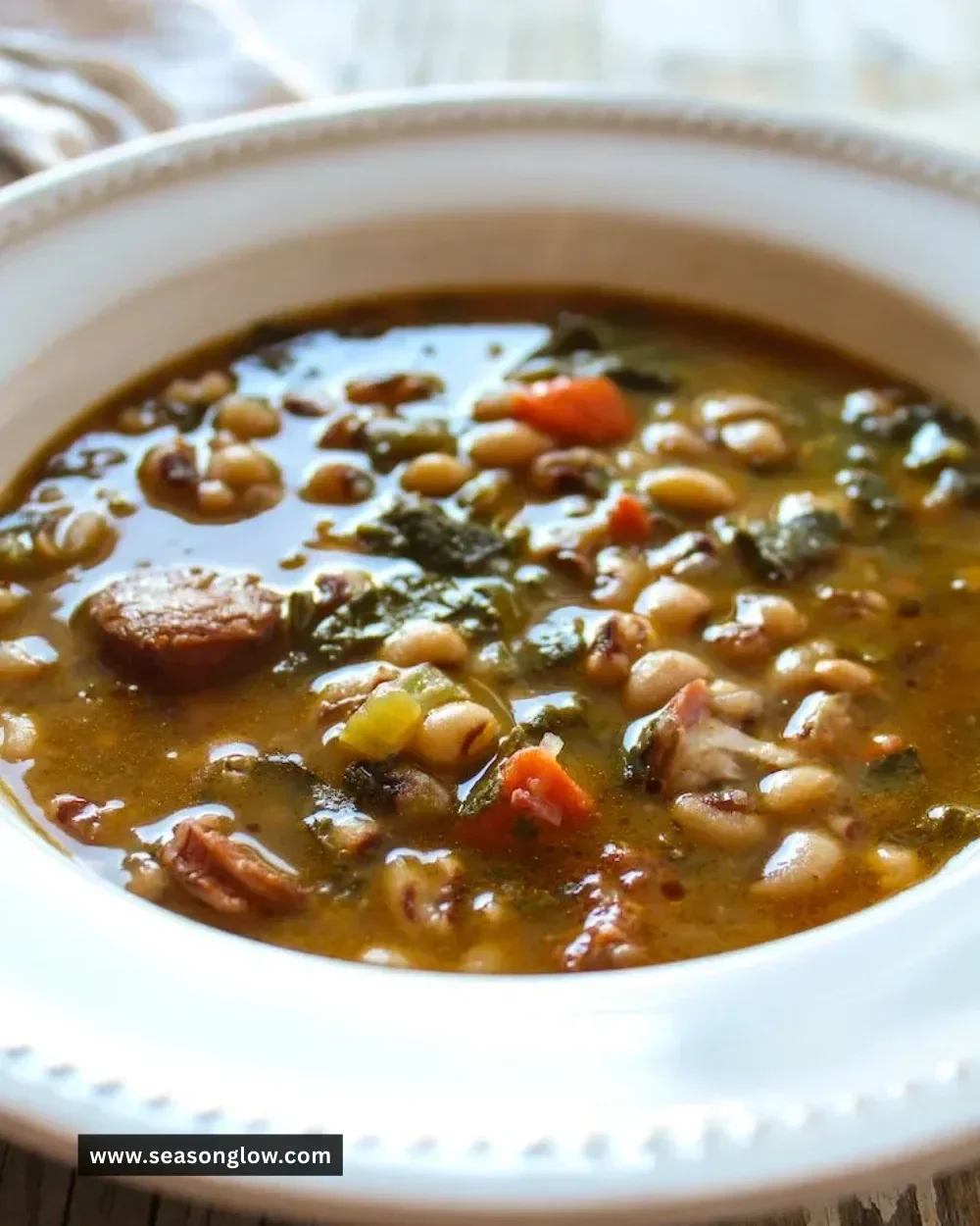 Bowl of Instant Pot black eyed pea soup garnished with herbs