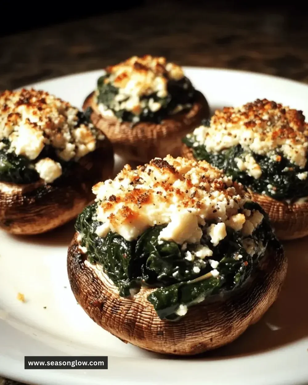 Spinach and feta stuffed mushrooms on a plate, perfect appetizer recipe.