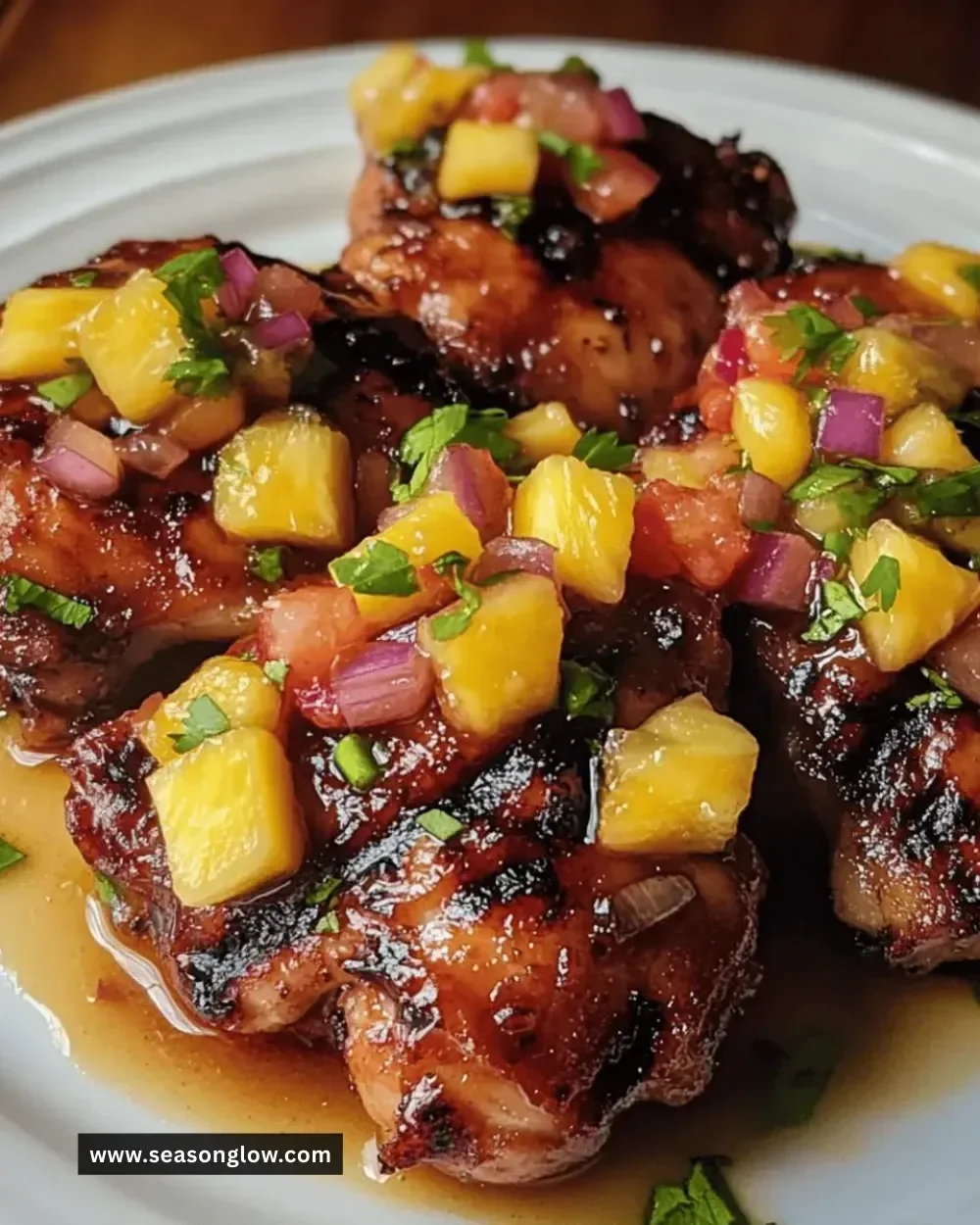 Juicy teriyaki chicken thighs topped with vibrant pineapple salsa