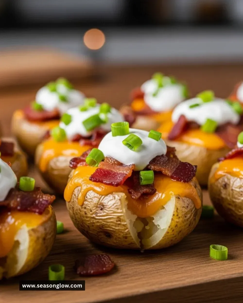 Delicious loaded mini baked potato bites topped with cheese, bacon, and chives.