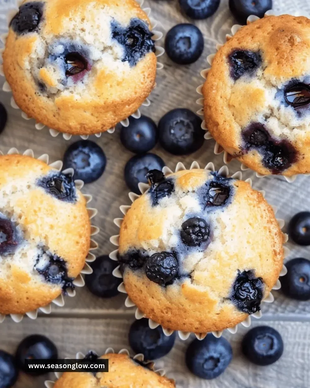 Low carb Greek yogurt blueberry muffins on a wooden table