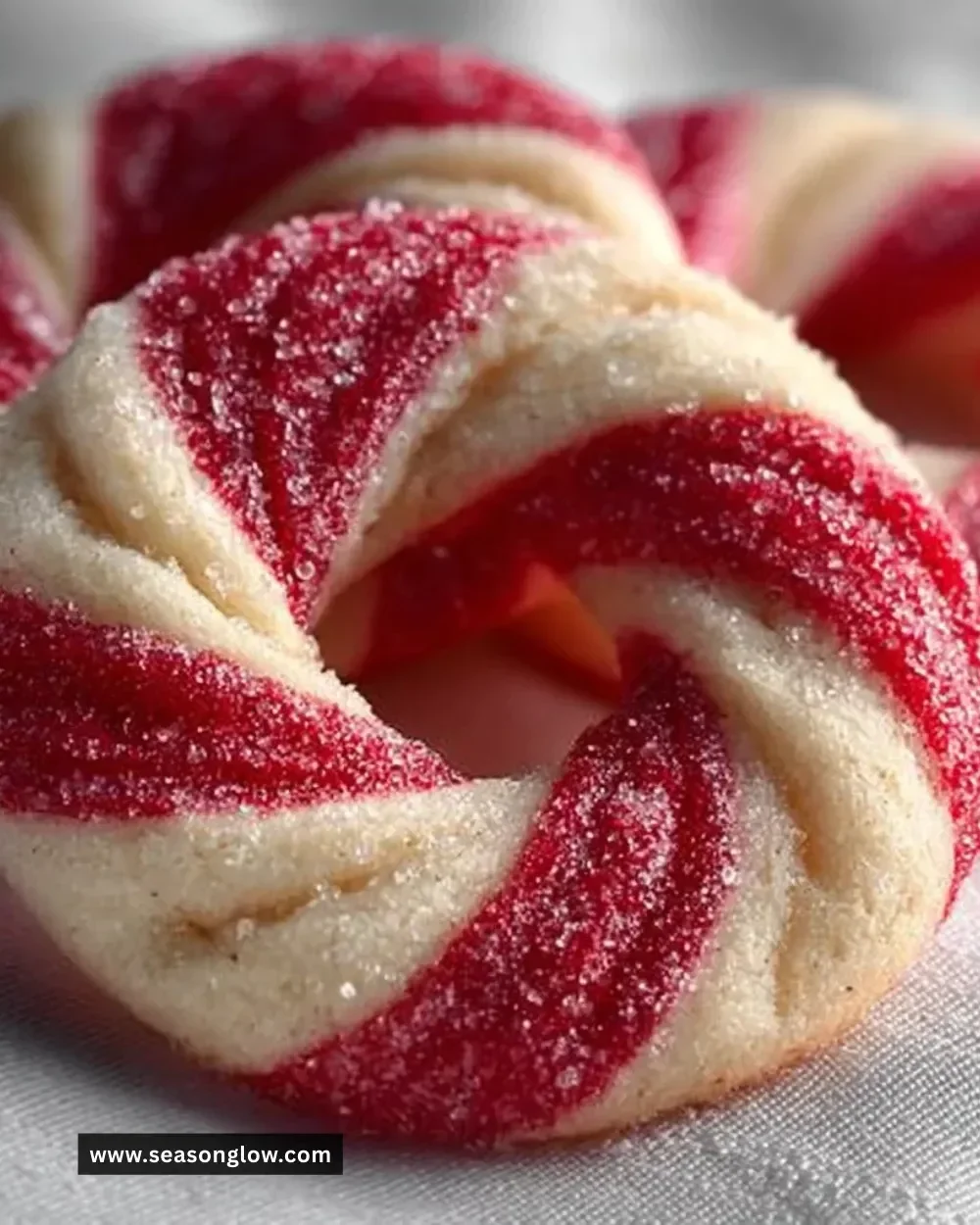 Delicious homemade candy cane cookies decorated with red and white sprinkles