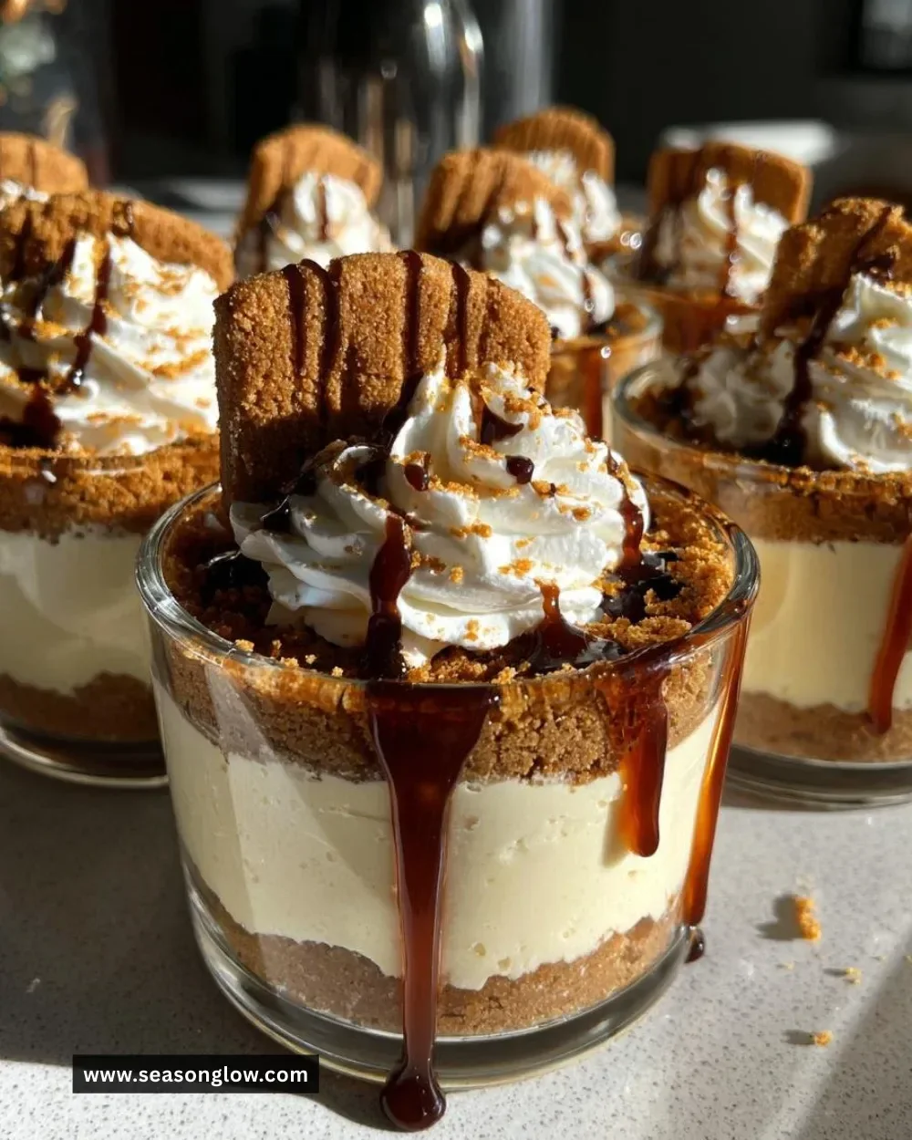 No bake gingerbread spice cheesecake cups topped with holiday decorations