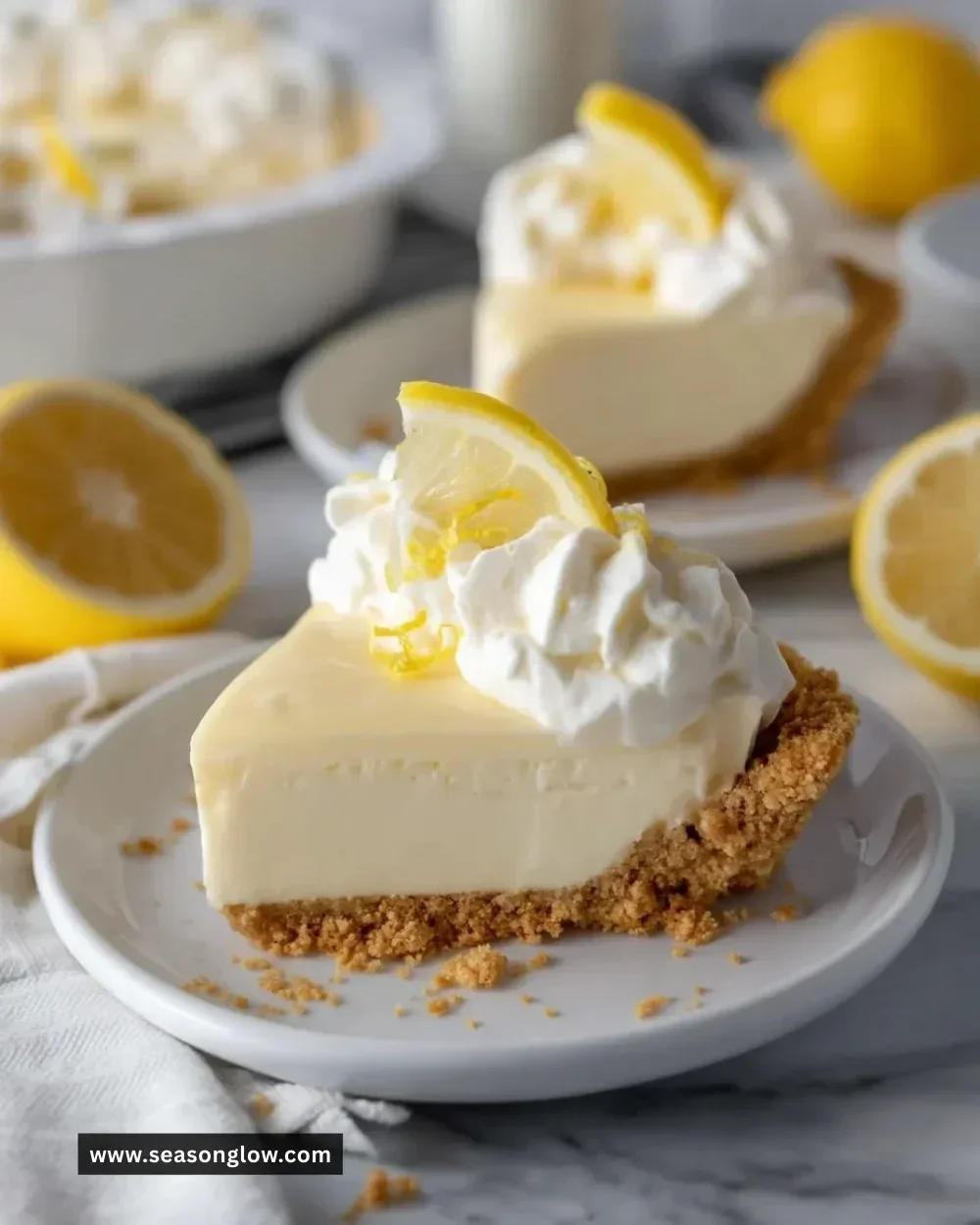 No Bake Lemon Pie topped with whipped cream and lemon zest