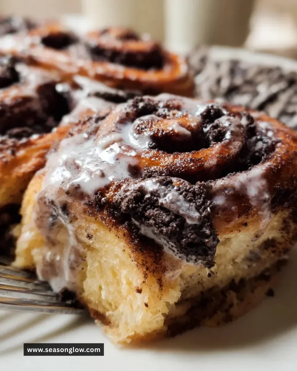 Freshly baked Oreo Cinnamon Rolls with creamy frosting