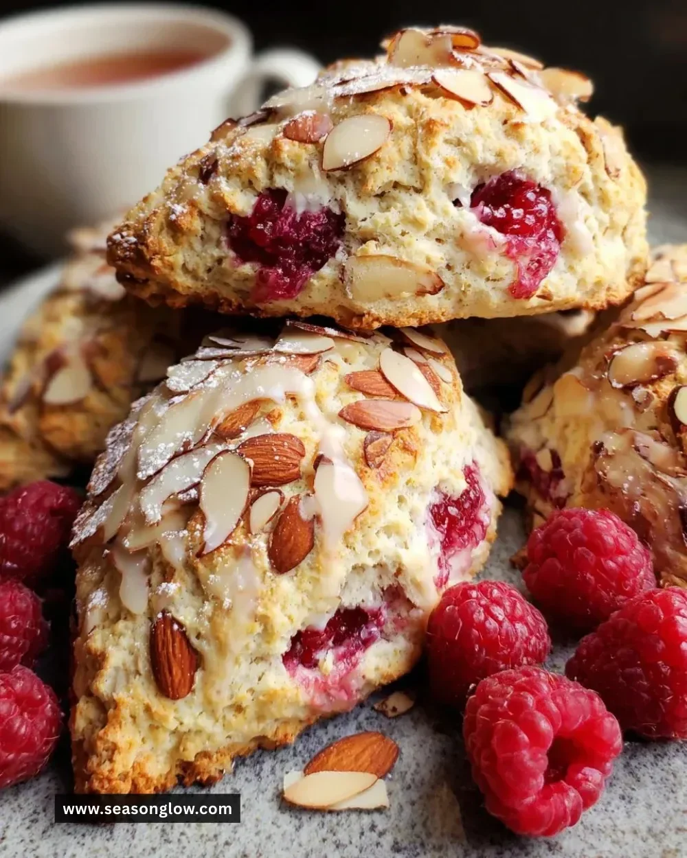 Freshly baked raspberry almond scones on a plate