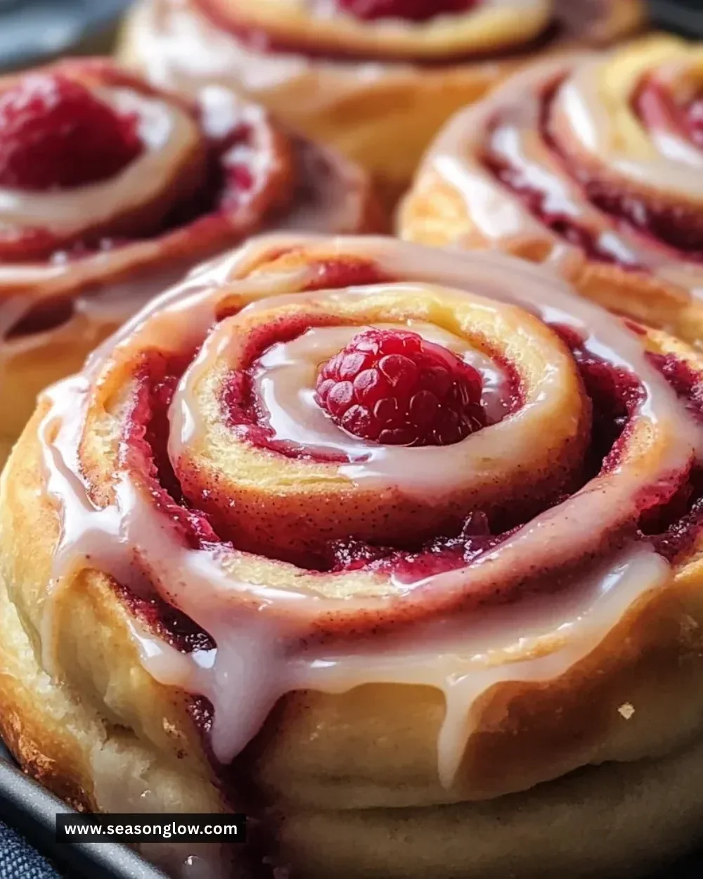 Homemade Raspberry Cinnamon Rolls with a sweet raspberry filling