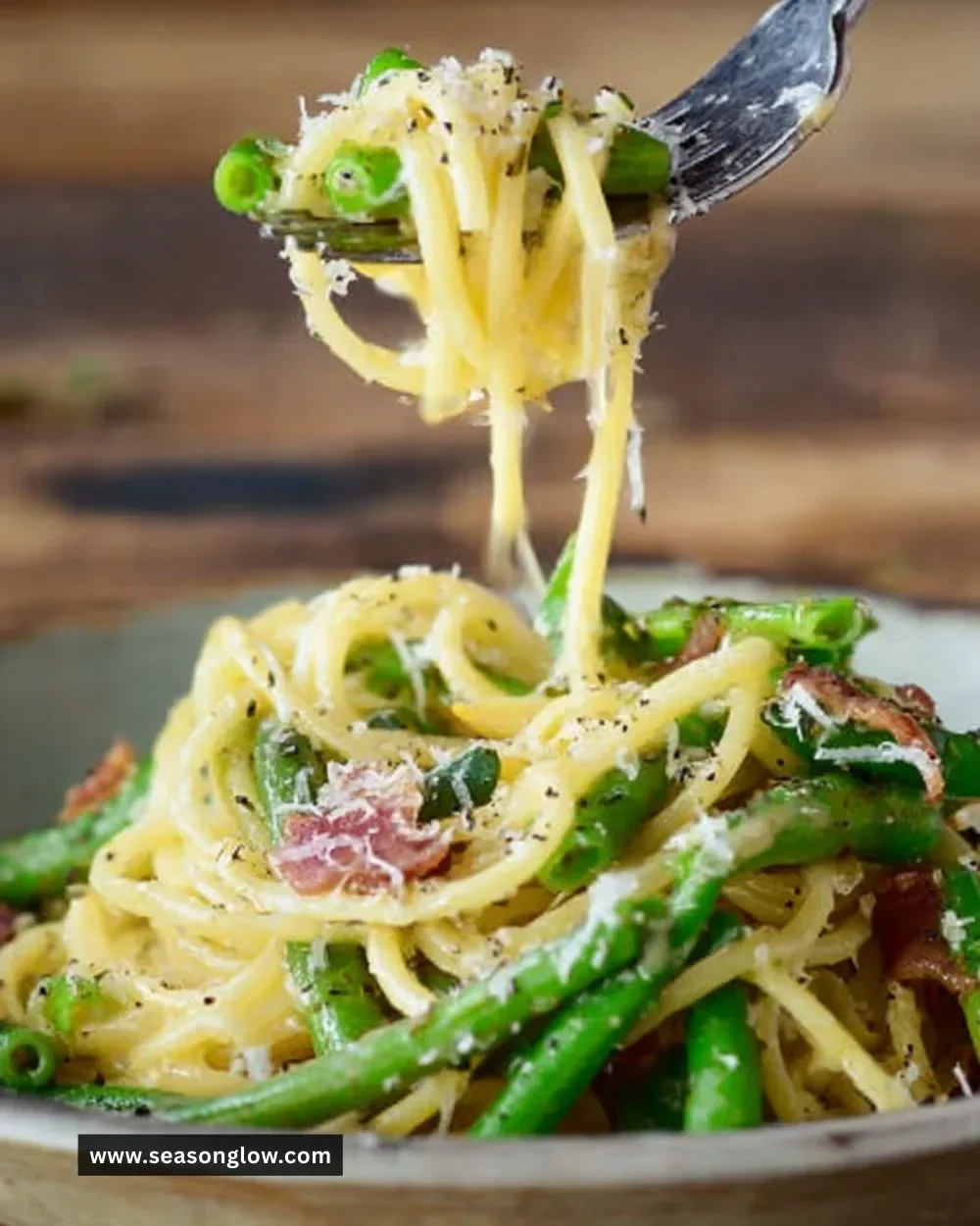 Delicious plate of Runner Bean Carbonara with fresh herbs and pasta.