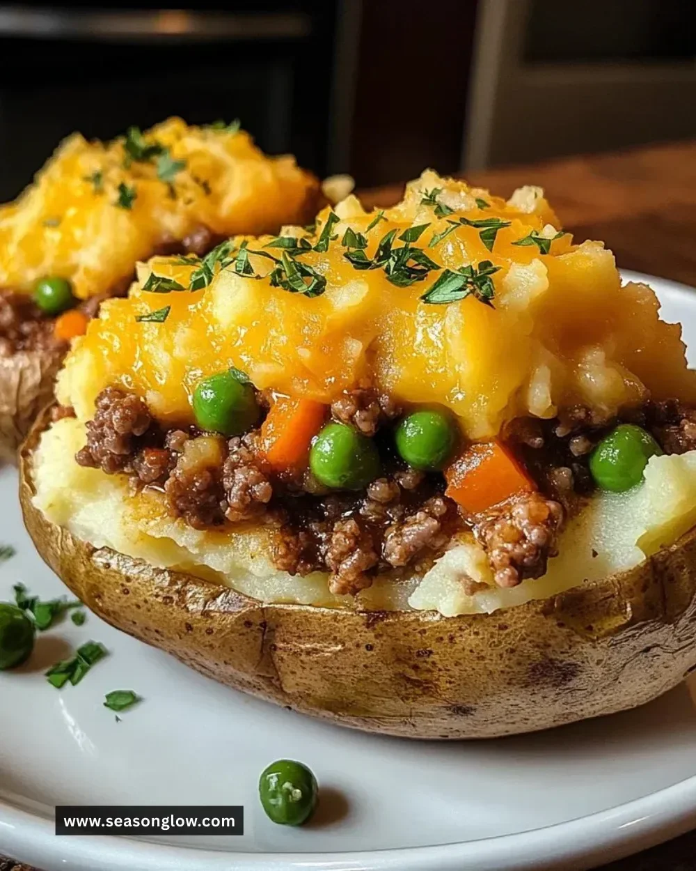 Delicious Shepherd's Pie Baked Potato topped with creamy mashed potatoes.