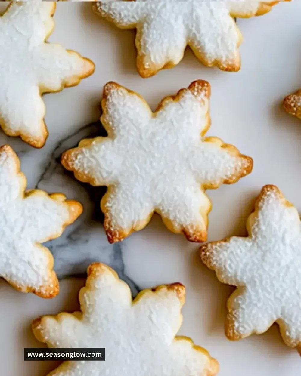 Beautifully decorated snowflake sugar cookies for winter festivities